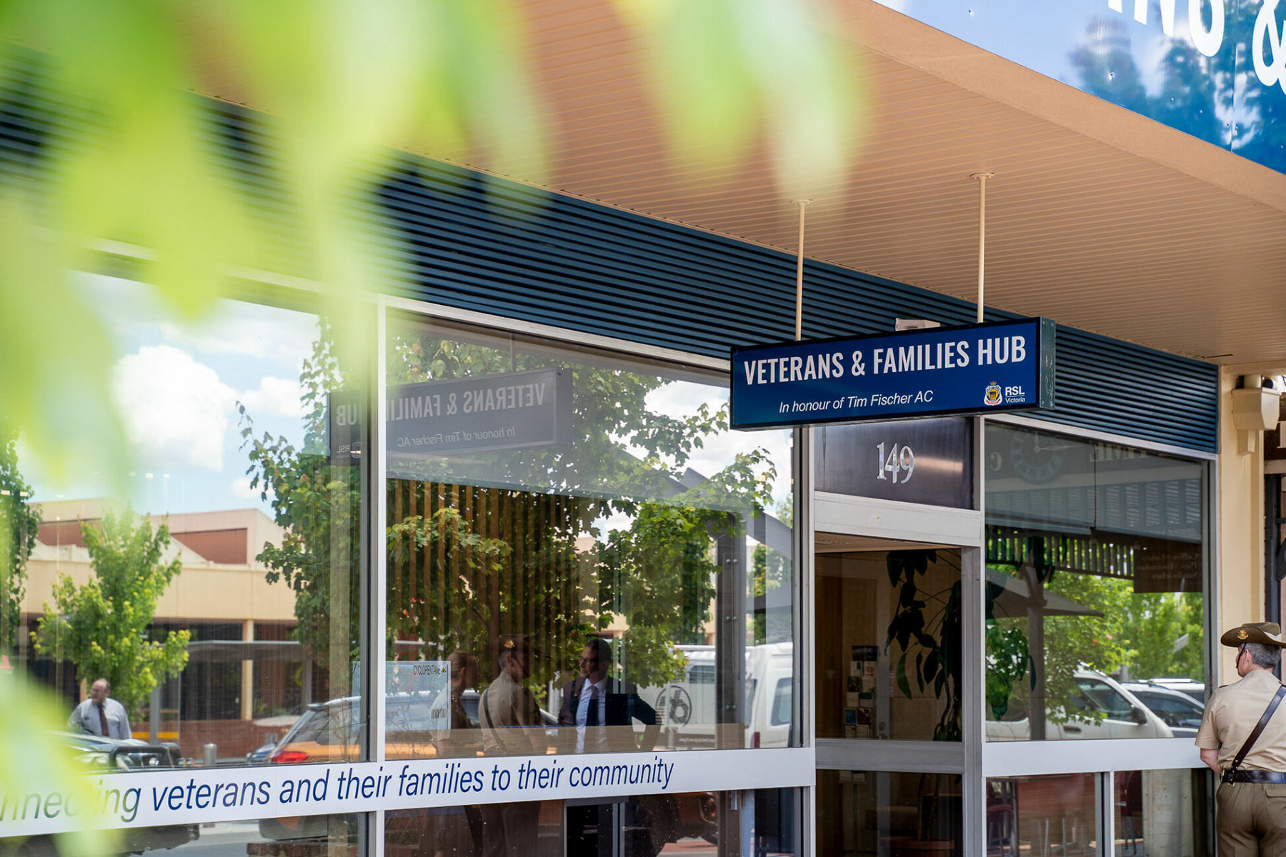 Front of the Wodonga Veterans and Families Hub building with a sign above the entrance, large glass windows, and a pathway leading to the door.