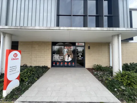 Entrance to the Shoalhaven Veteran and Family Hub with signage and a pathway leading to the front doors.