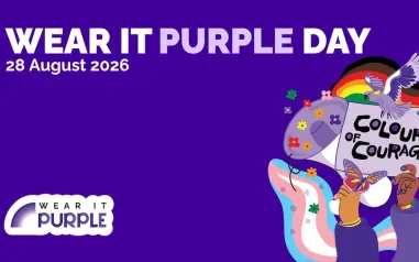 A purple background with text which says Wear It Purple Day 28 August 2026. There is a cartoon drawing of hands holding up a sign saying Colours of Courage.