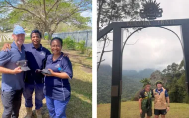A photo of two people standing under a sign that says Kokoda Trail.
