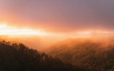 A sunset over a mountain range.