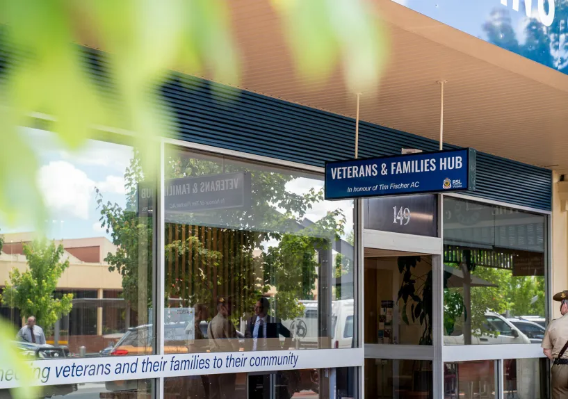 Front of the Wodonga Veterans and Families Hub building with a sign above the entrance, large glass windows, and a pathway leading to the door.