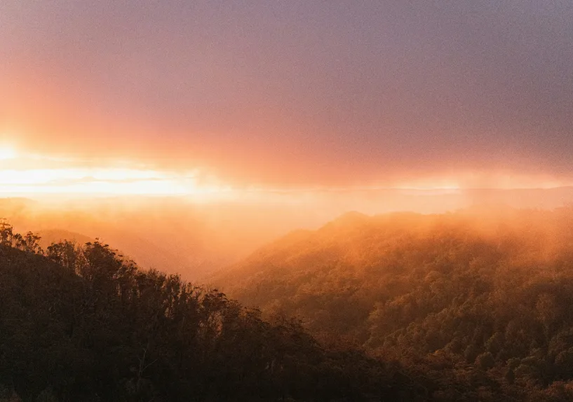 A sunset over a mountain range.